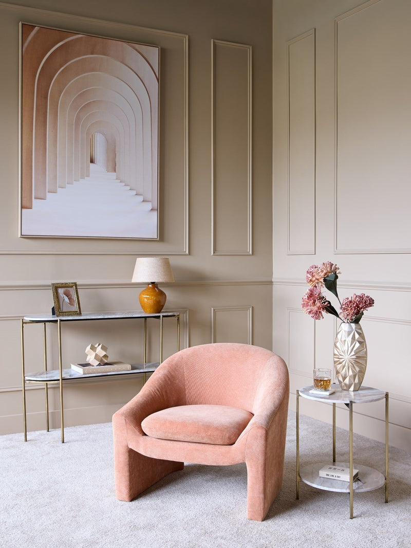 A panelled living room, features a table lamp on a console table