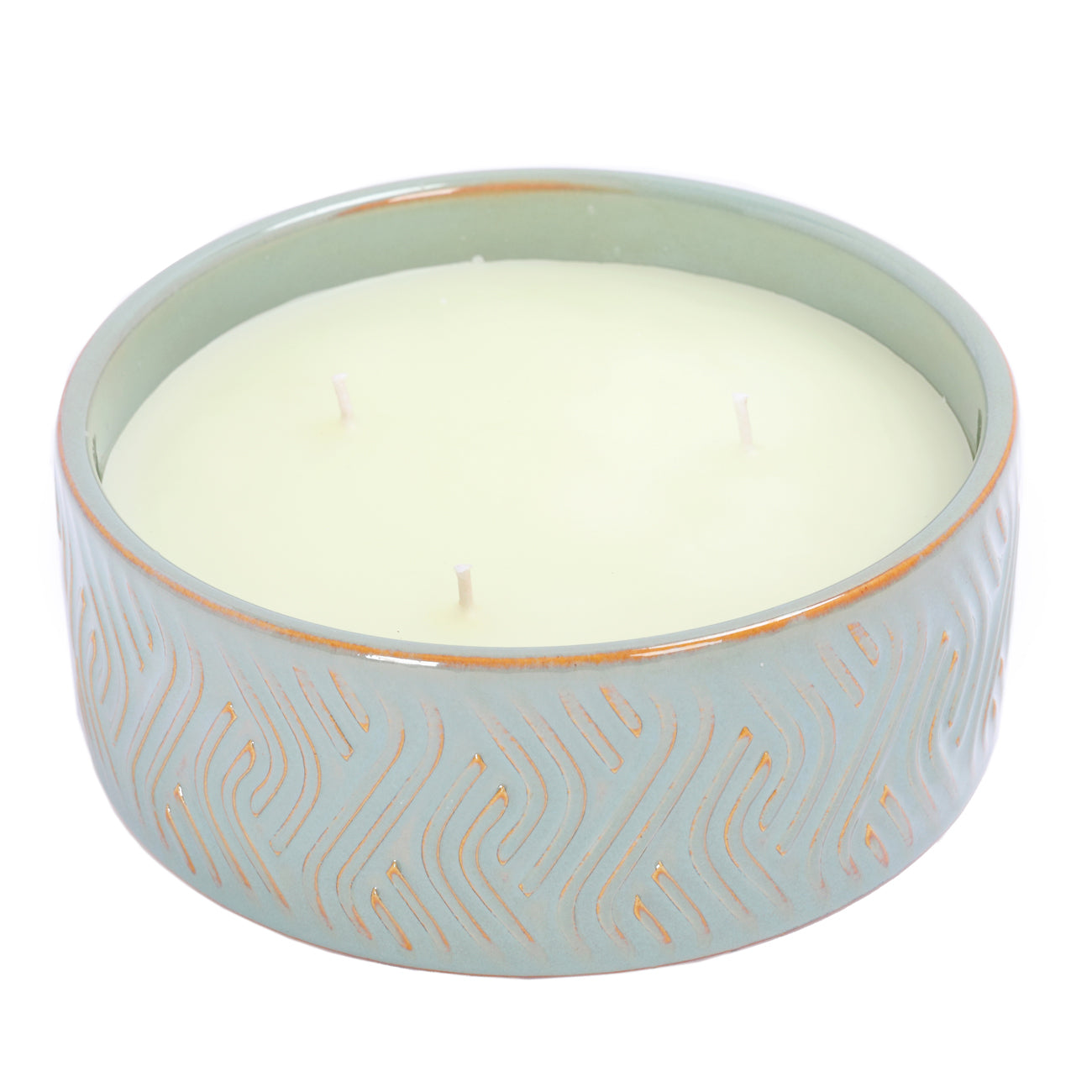 Ceramic green candle holder with a white triple wick candle inside