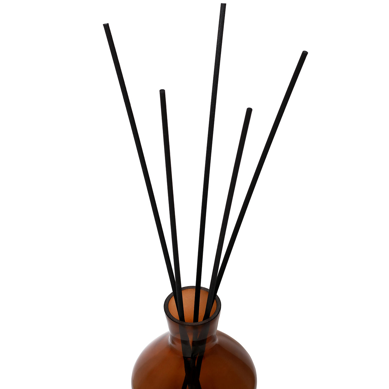 Brown diffuser bottle with black sticks on a white background