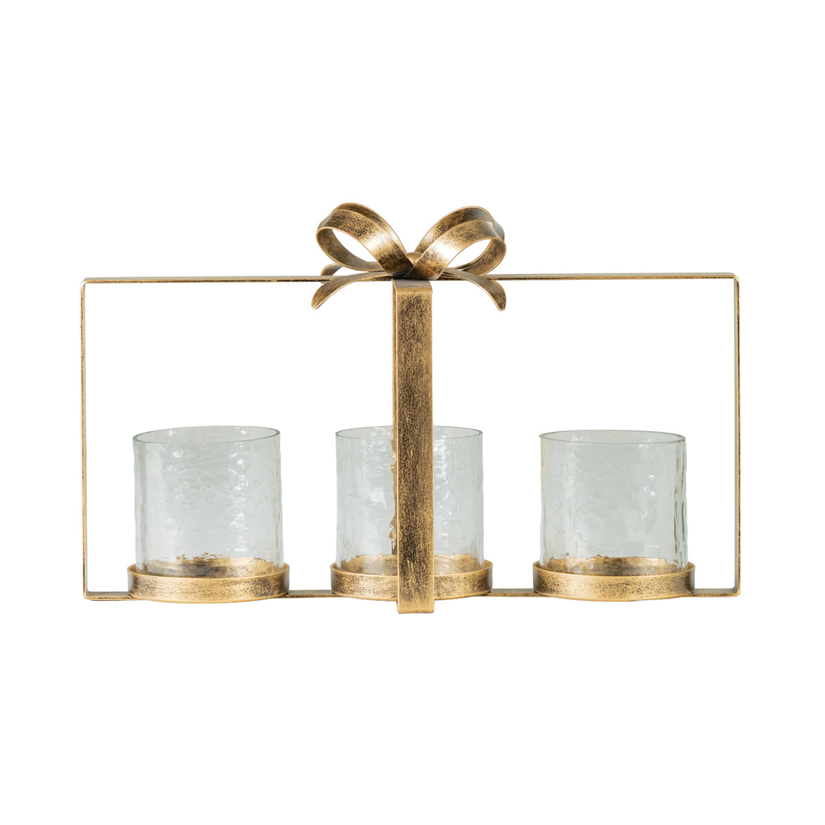 A three-light candle holder with a distressed gold metal frame, bow detail on top, and three clear textured glass cups.