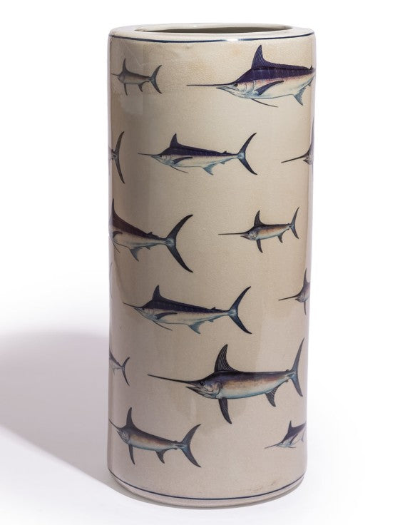 Cylindrical umbrella stand with fish pattern on a beige background