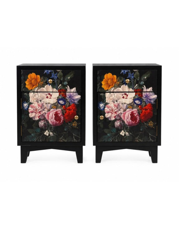 A pair of black two-drawer nightstands featuring a vibrant, multicolored floral print on the front doors, with small gold knobs and short legs.