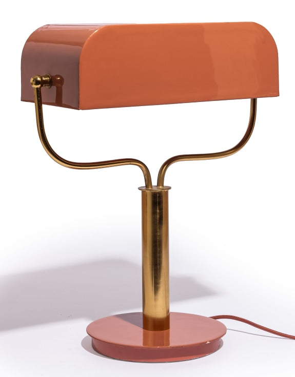 Table lamp with a copper-colored base and shade 