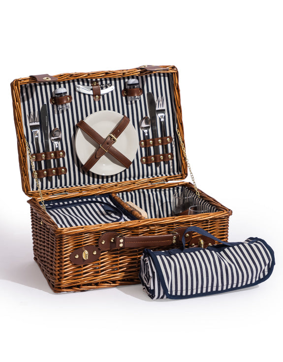 picnic basket with cutlery and a blanket