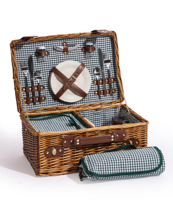 Wicker picnic basket with checkered interior, cutlery, and a blanket.