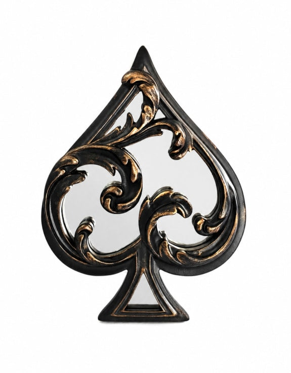Decorative wall mirror shaped like a spade with intricate gold detailing 