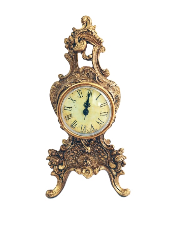 Decorative gold clock with Roman numerals 