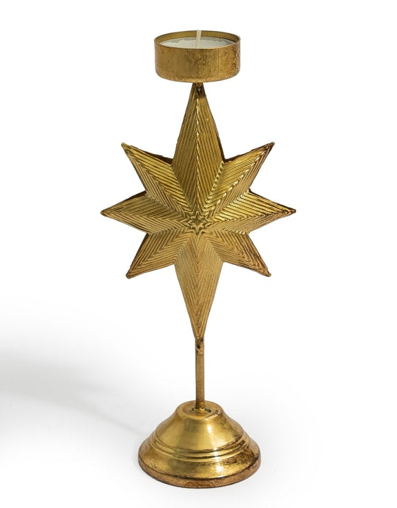 A brass star-shaped candle holder with a circular base and a top cup to hold a tealight candle.