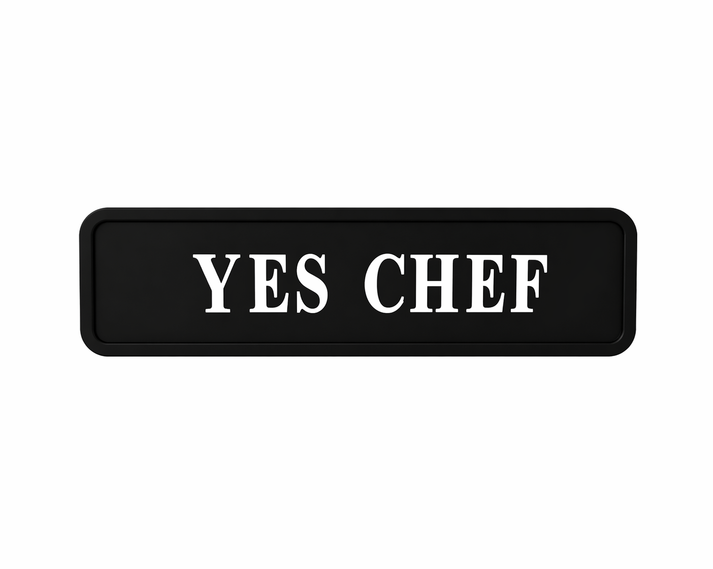 black wall sign with 'yes chef' quote in silver