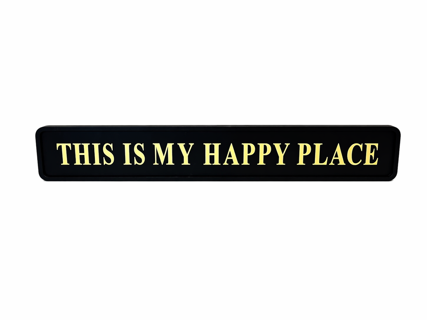 Black wall sign with gold text 'THIS IS MY HAPPY PLACE' 