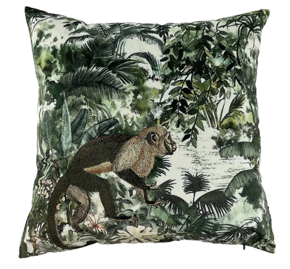Funky embroidered cushion with a monkey and green jungle design on a white background. Perfect for Animal lovers.