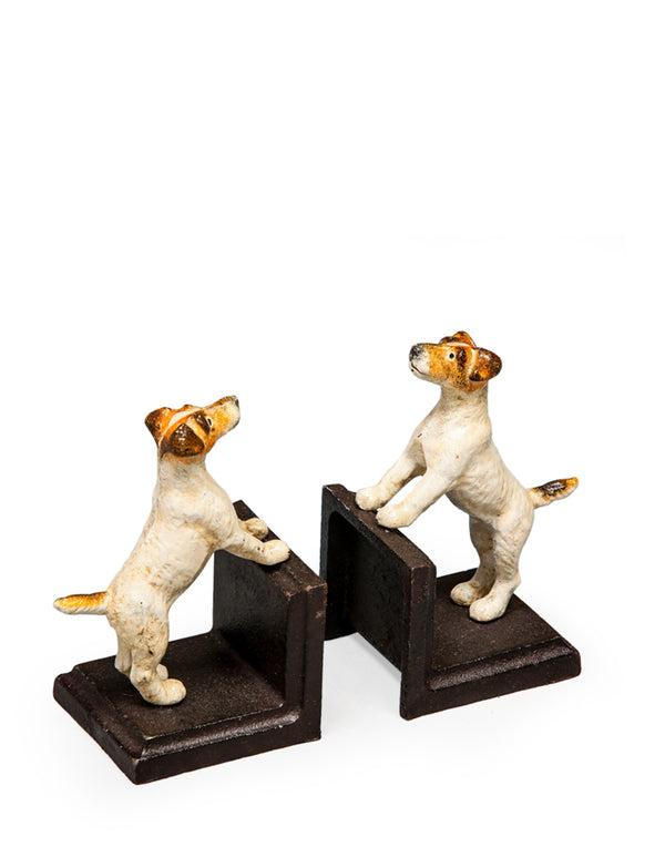 A pair of sturdy cast iron bookends in the shape of Jack Russell terriers standing on a dark base.