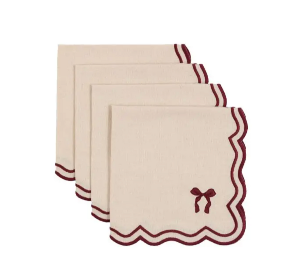 Four cream-colored square linen napkins with scalloped burgundy edges and a small bow motif