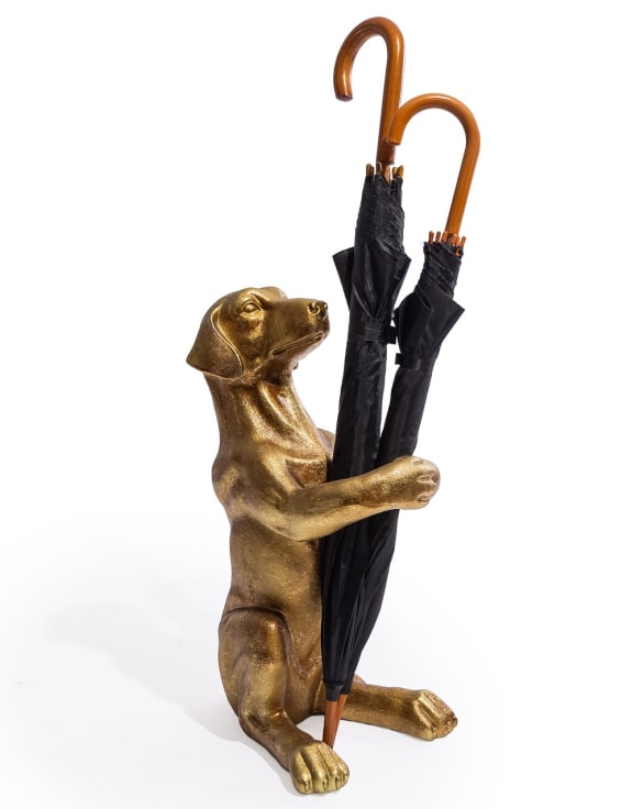 Bronze dog-shaped umbrella stand holding an umbrella 